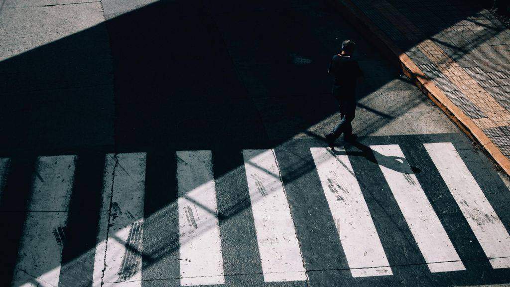 faded crosswalk needing pavement repair before school starts